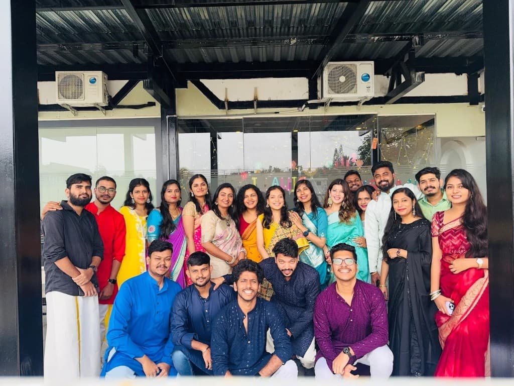 Team dressed in traditional attire for a celebration