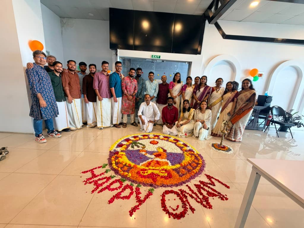 Onam celebration with floral rangoli in the office